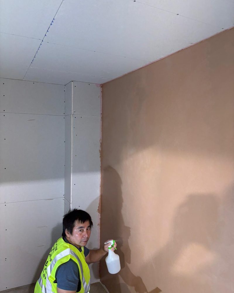 A student stood beside the wall he skimmed on the two-day course